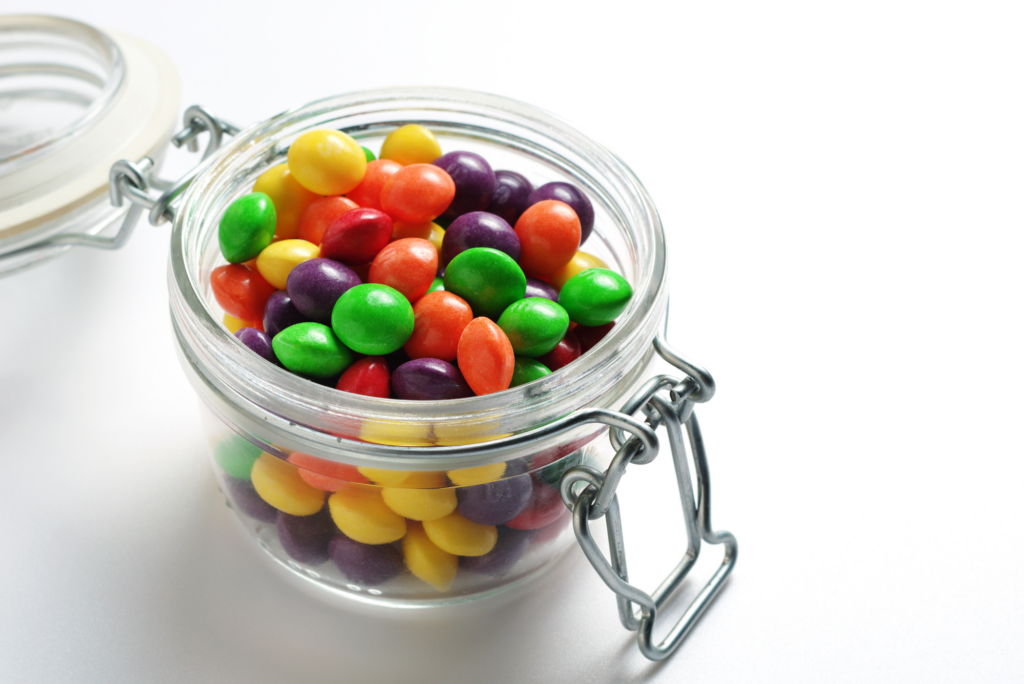 A jar of candy, embodying the transition from candy cravings to balanced living.