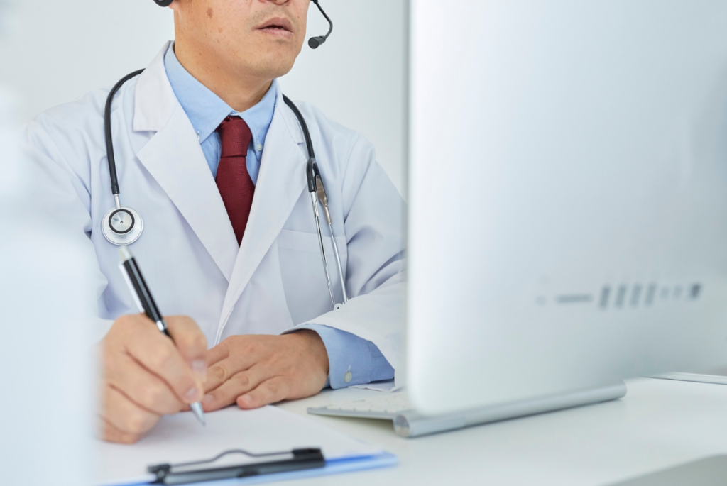 A physician conducts a virtual consultation.